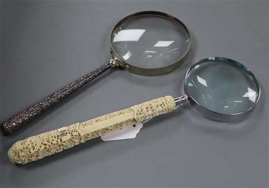 A Canton carved ivory parasol handle with later magnifier, 34cm, together with a white metal handled magnifier